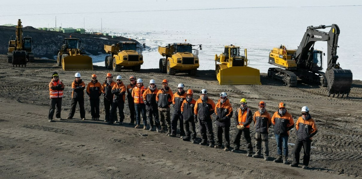 Isaac Group team and earthmoving equipment at Scott Base Antarctica